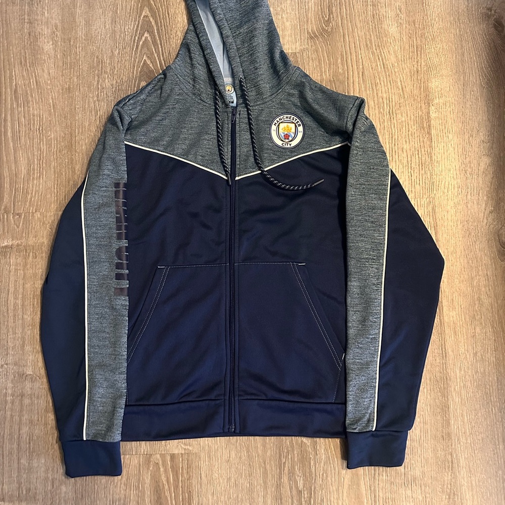 Brand New Manchester City Men's light blue and Navy Lightweight Jacket